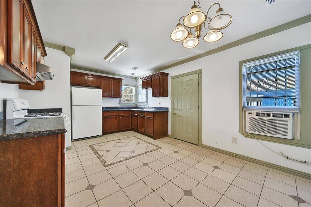 Kitchen area has back door that leads to outside.