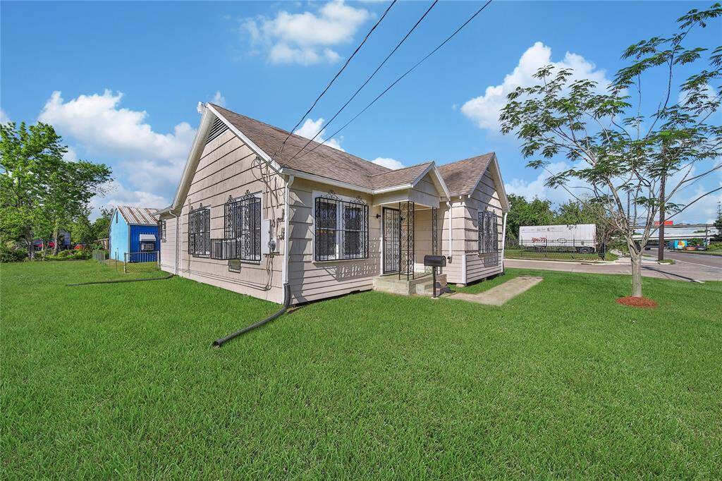 This charming bungalow sits on an oversized lot with plenty of space outside.