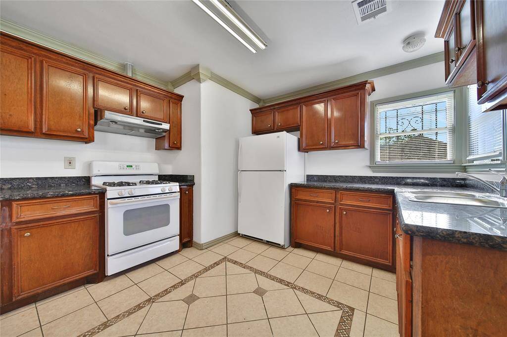 Granite countertops and gas range.