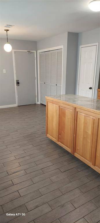 Kitchen View Showing the Pantry, Utility Area & Exit to Attached Garage