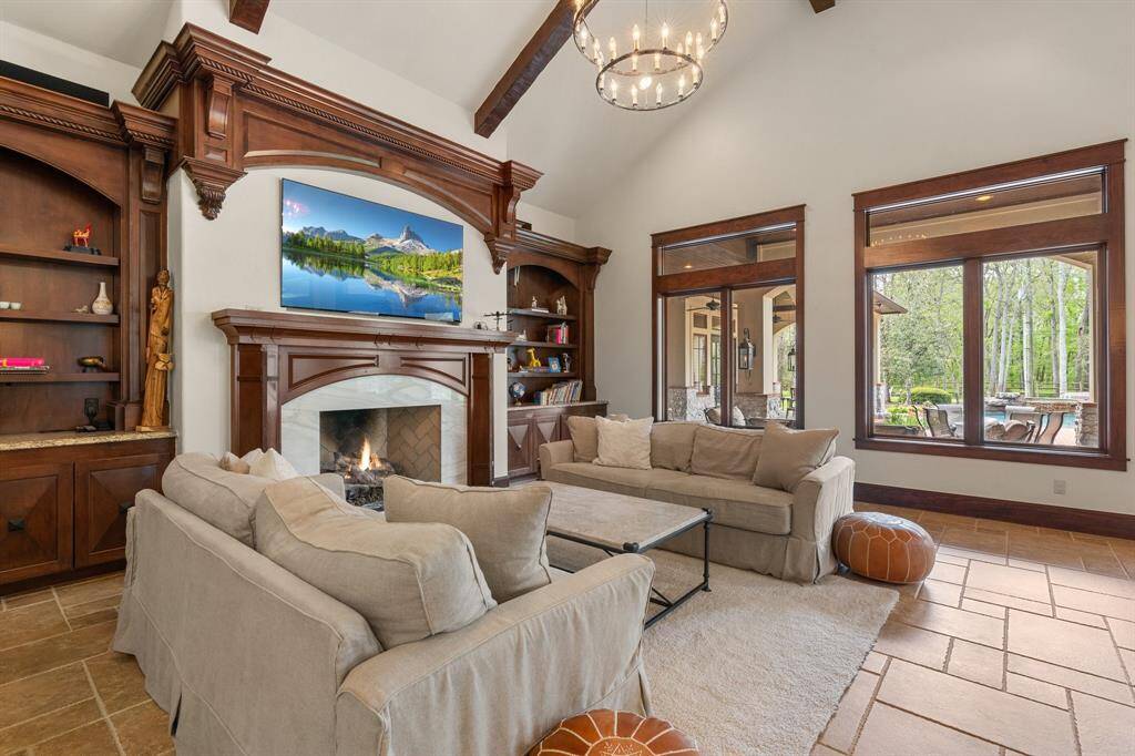 The living room features a cozy fireplace, creating a warm and inviting ambiance for relaxation and gatherings.
