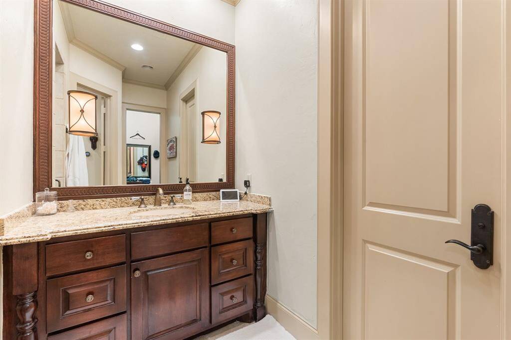 A compact vanity adds a touch of elegance and functionality to the space, providing a dedicated area for grooming and personal care.