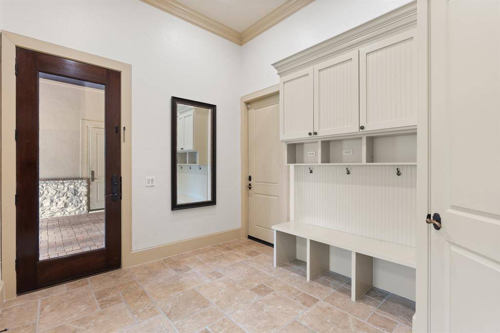 Boasting beautiful built-ins this Mudroom in sure to be the perfect stopping point before entering the rest of the home!