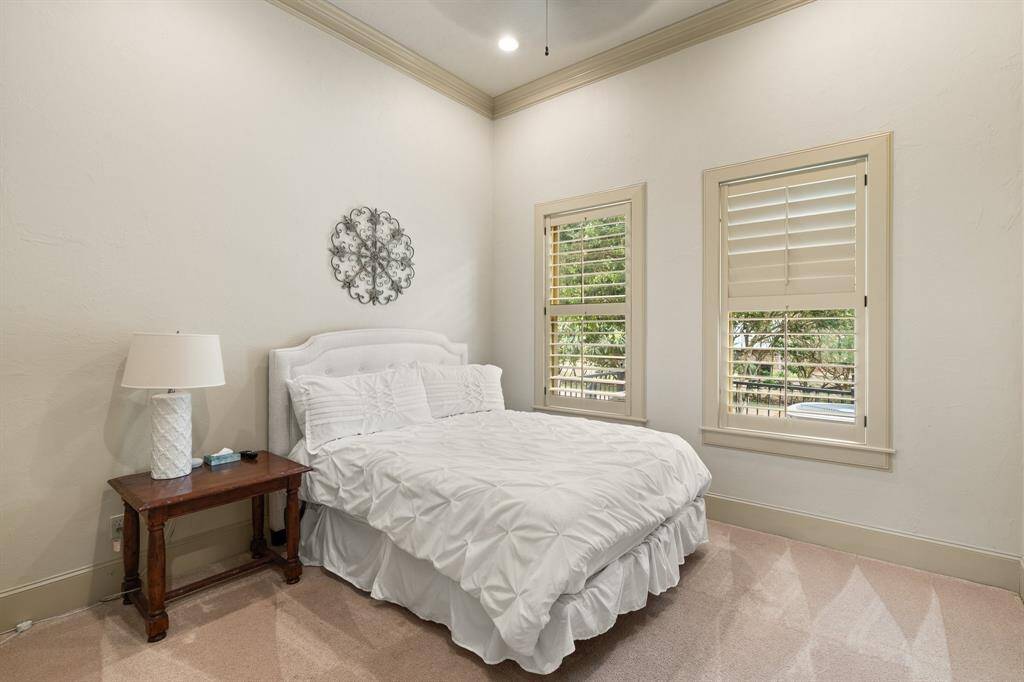 The bedroom offers a generous amount of space, providing a comfortable and inviting retreat for rest and relaxation.