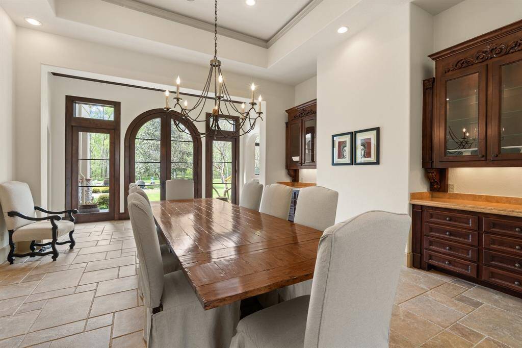 The formal dining area, ready to host memorable gatherings and elegant meals.