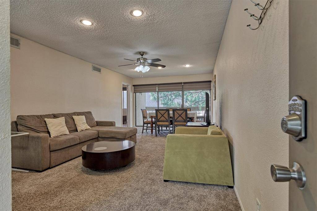 Floor to ceiling windows with a sliding back door let in an abundance of natural light.