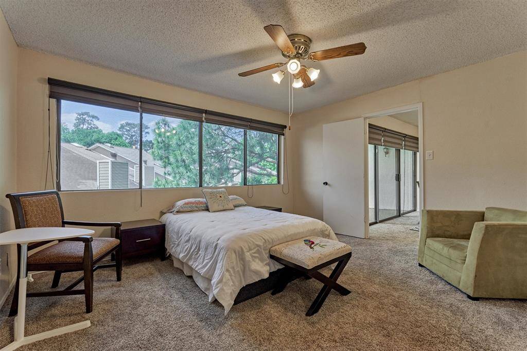The primary bedroom is located toward the back of the property and is large enough for a king size bed and sitting area.