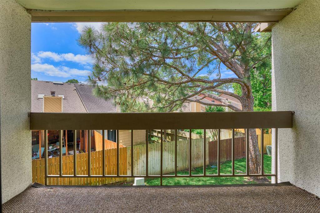 Your balcony overlooks green space and other townhomes in Walden.