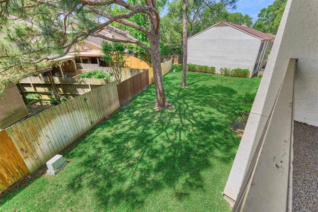 Behind this row of condos, we see plenty of green space for pets or play.