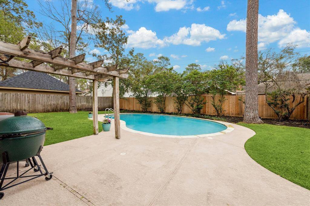 Patio area and pergola enhance this nice backyard space.  Please note there is a "catch a kid" system and gate which can be installed if desired.
