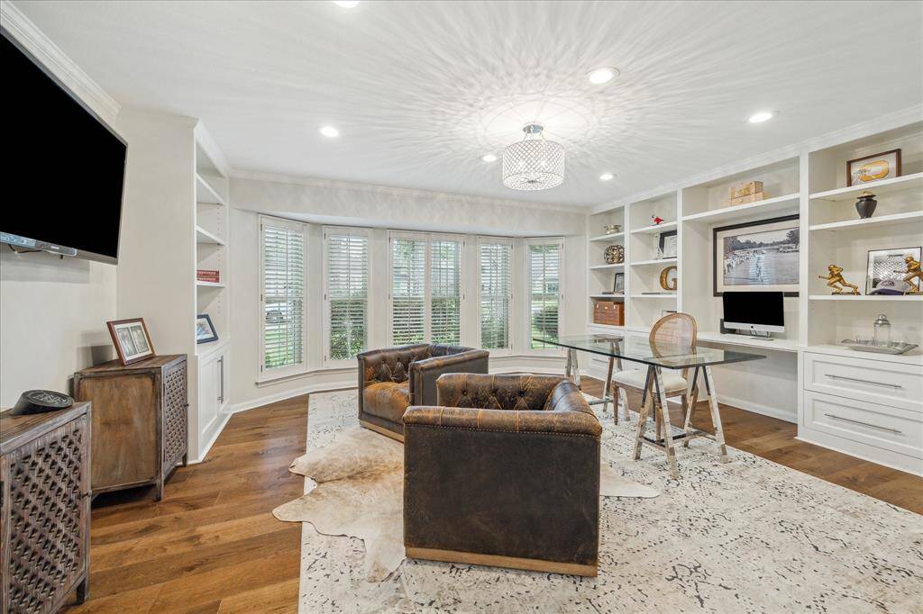 Large study or second living area with large bay window and hardwoods