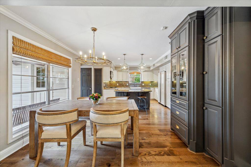 Breakfast area with built-ins opening into the island kitchen
