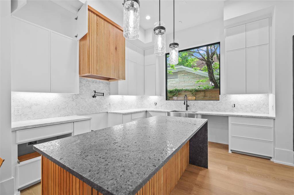 Custom cabinets, oversized islands, stainless steel appliances, BOSCH DUAL FUEL range. Current stage of construction 4/24* Estimated completion 5/1.