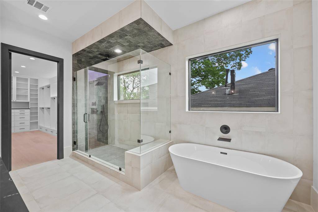 Primary Bathroom, separate shower and soaking tub. *Photo shown is of the model home. Finishes and selections may vary.