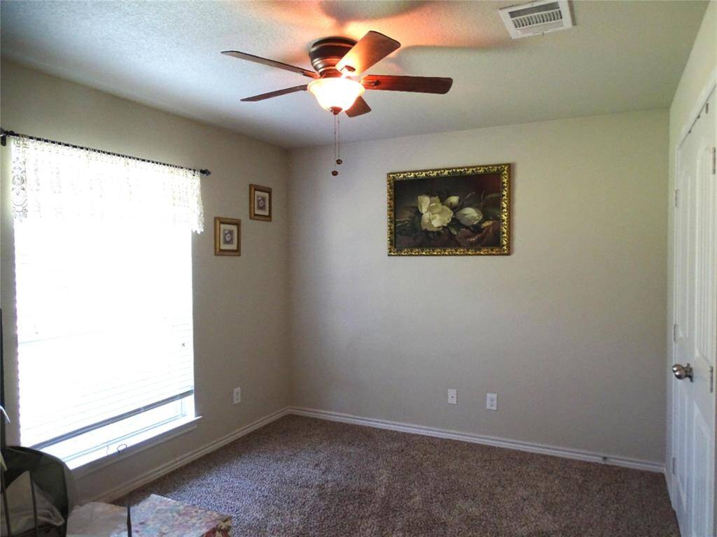 Office sits on the left front side of home next to the entry.