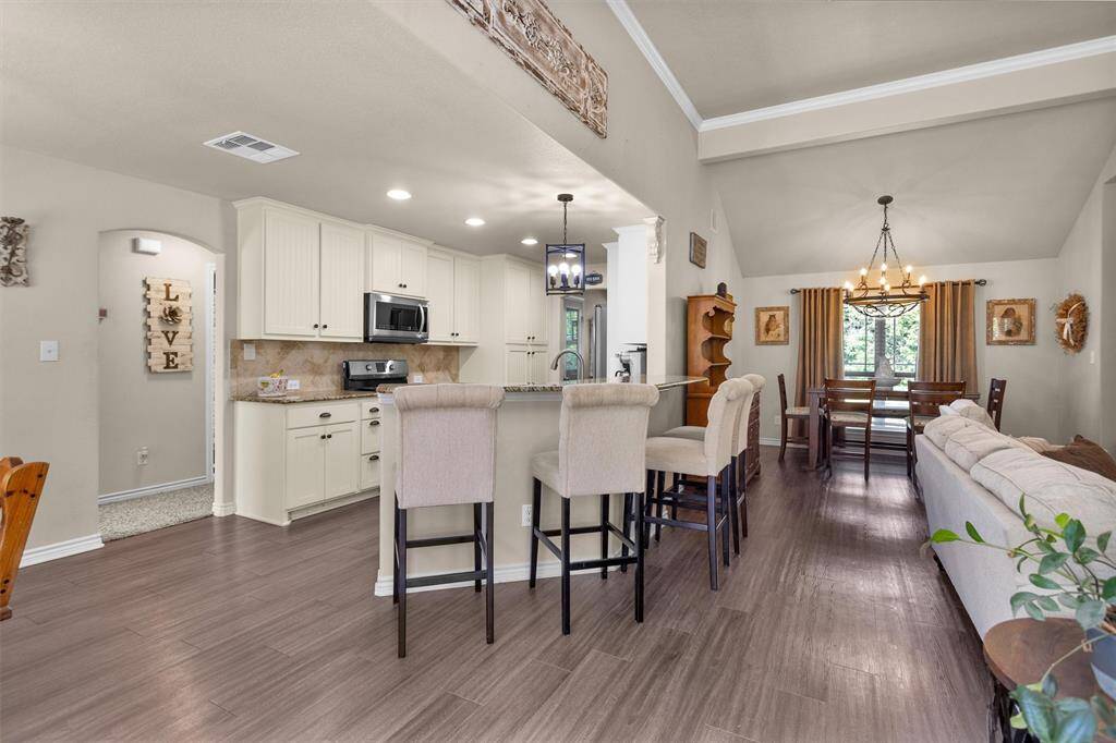 View of kitchen bar and dining area.