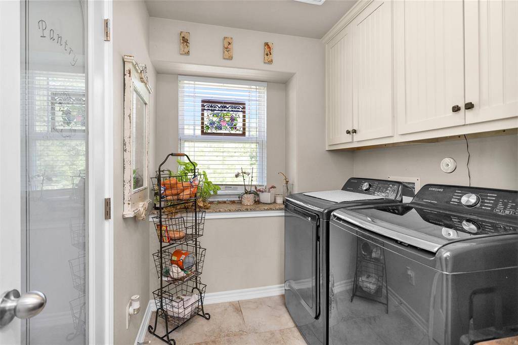 Utility room has electric or gas propane hook ups, cabinet space and nice size pantry.  Window is nice to bring in that nature lighting or letting in fresh country air.