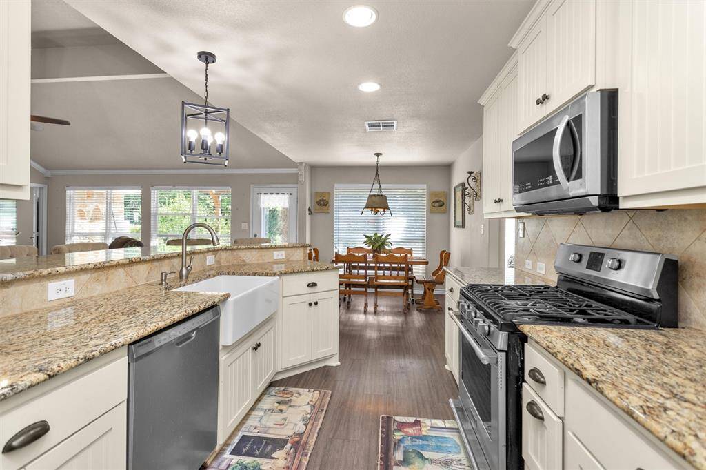 Stainless steel appliances and large barn sink is a plus.