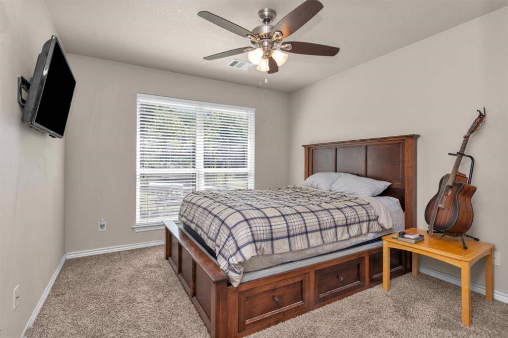 Guest room one is situated on back side of home.  Second guest room two sits on the front side of home between guest bath.