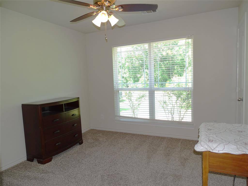 Guest room 2 sits in the front of home on right side of home.