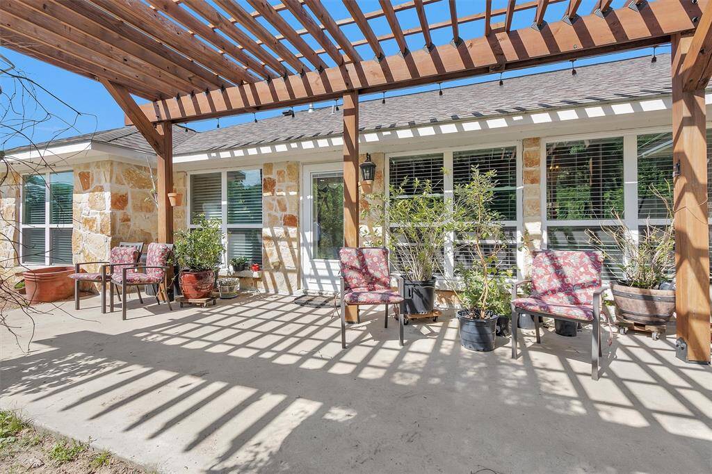 Large cedar pergola for additional shade and perfect for climbing rose bushes.