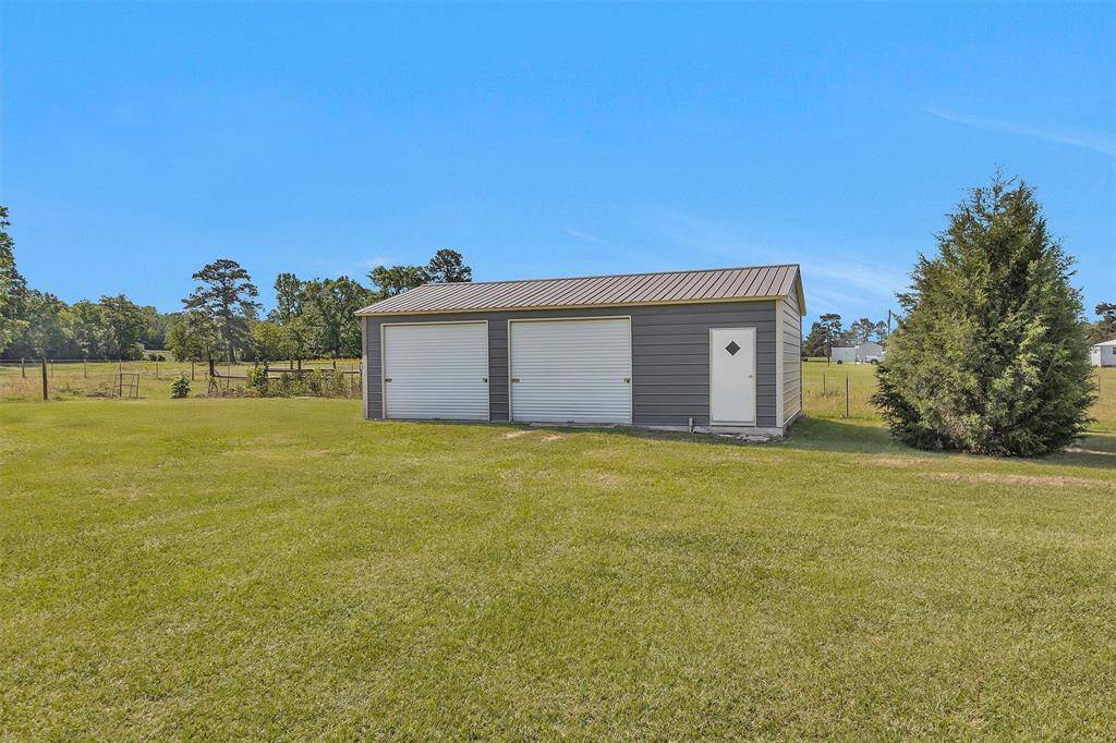 Workshop is 770 sq.ft. (35x22) inside.  Plenty of room to park vehicle, large equipment, toys and room for work space. Property line is just behind shop.