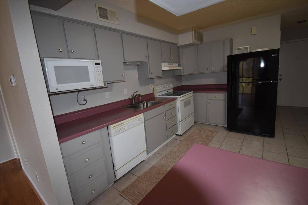 This kitchen layout is compact and functional.