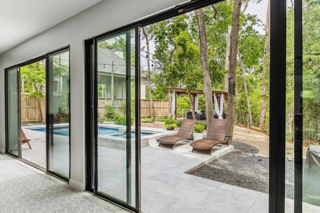 Big sliding doors open the main living space to the great back yard.