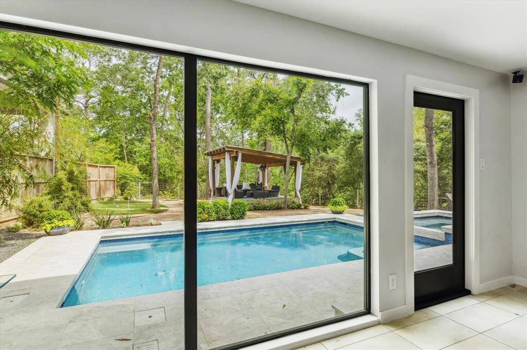 Views of the back yard from the playroom which could also be a guest suite.