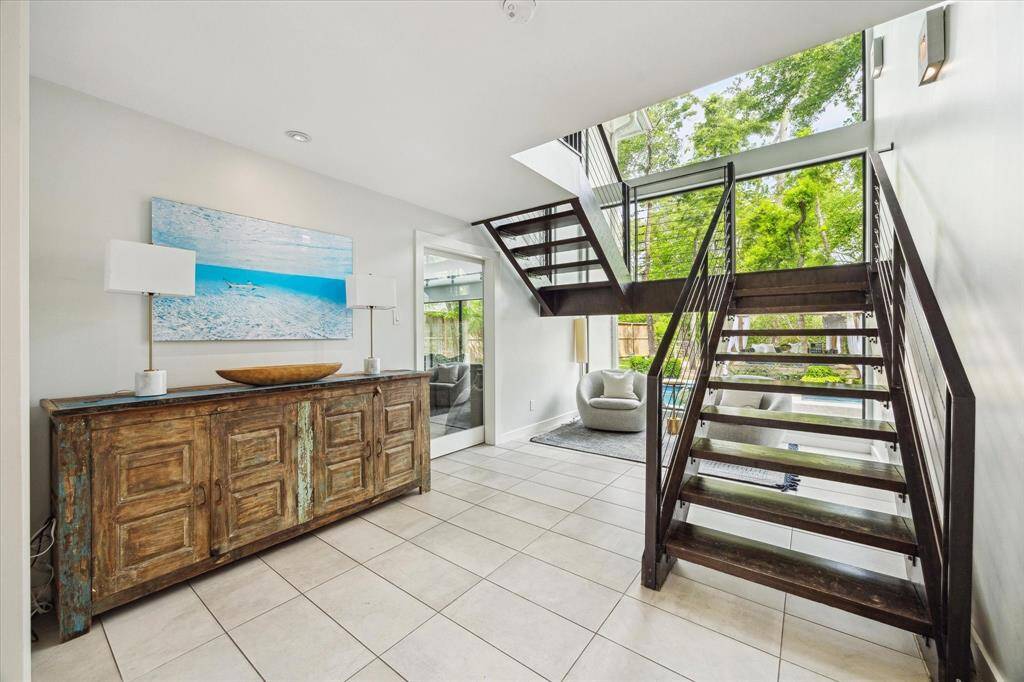 Reading nook under the stairs is a perfect spot to enjoy the backyard views.