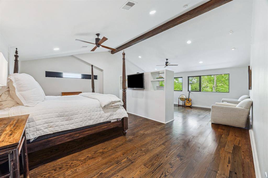 Huge primary, split-suite has a bedroom and an office with more great views of the backyard and surrounding greenery.