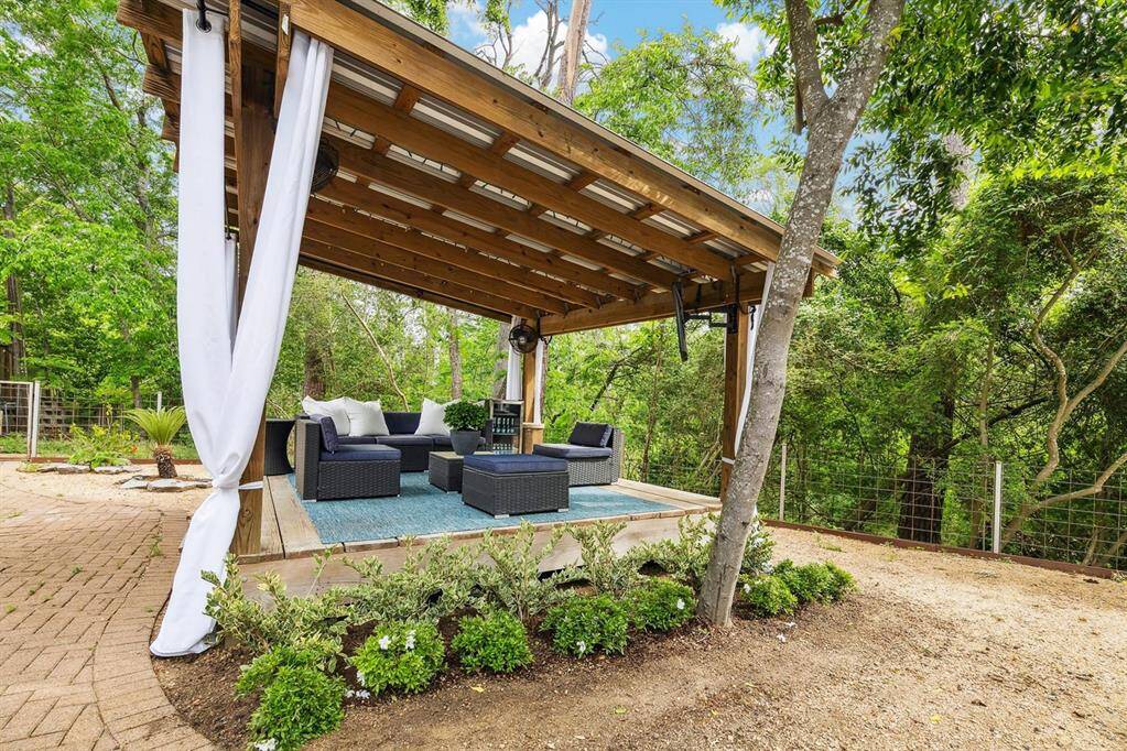 Huge back yard features pristine swimming pool, spa, putting green, and cabana.