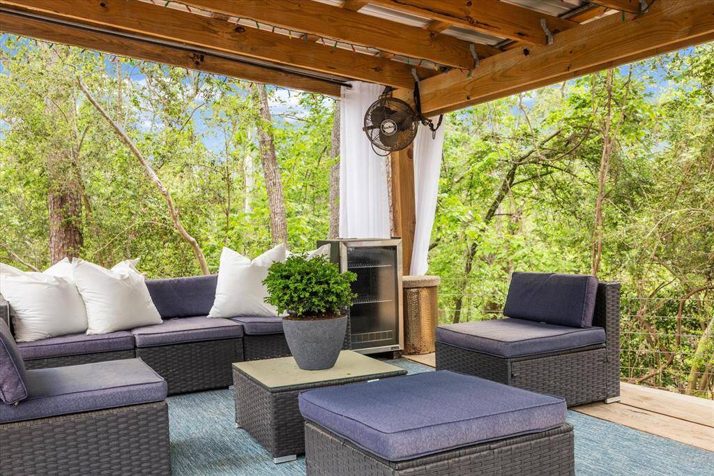 Huge back yard features pristine swimming pool, spa, putting green, and cabana.