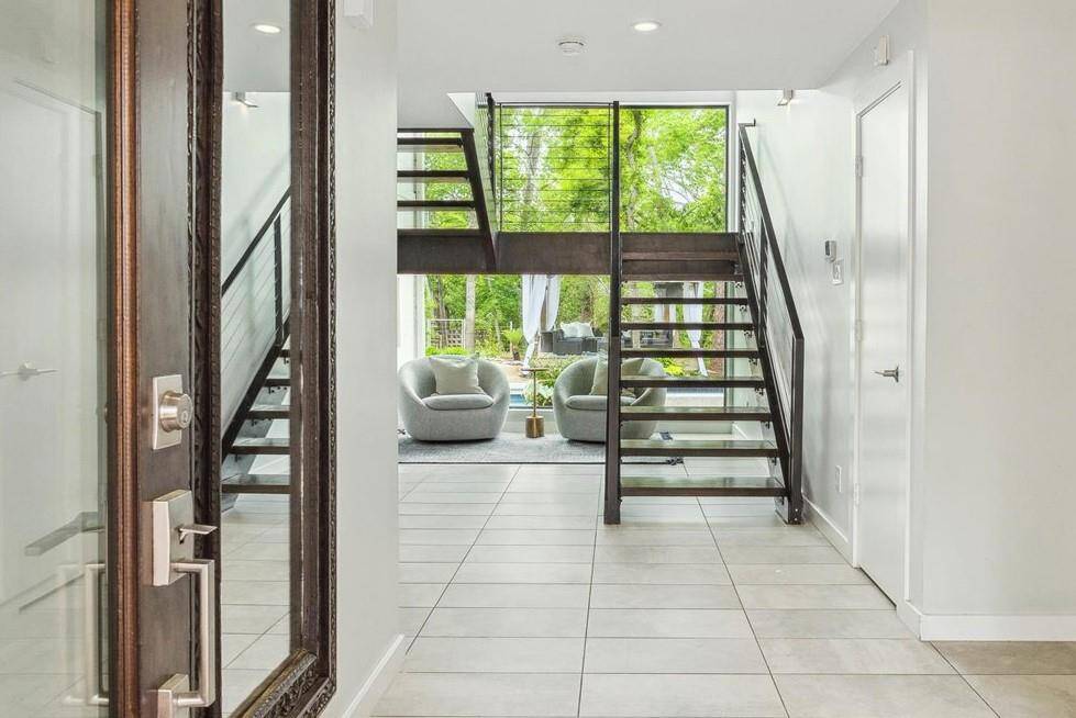 Step inside and immediately enjoy the first of many views of the huge back yard with pristine swimming pool, putting green, and cabana.
