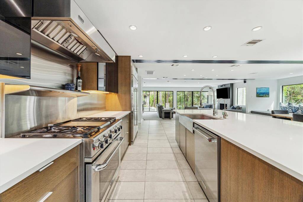 Enjoy cooking and being with family in the main, open-concept living space which is also perfect for entertaining with large sliding doors that open to the back yard.