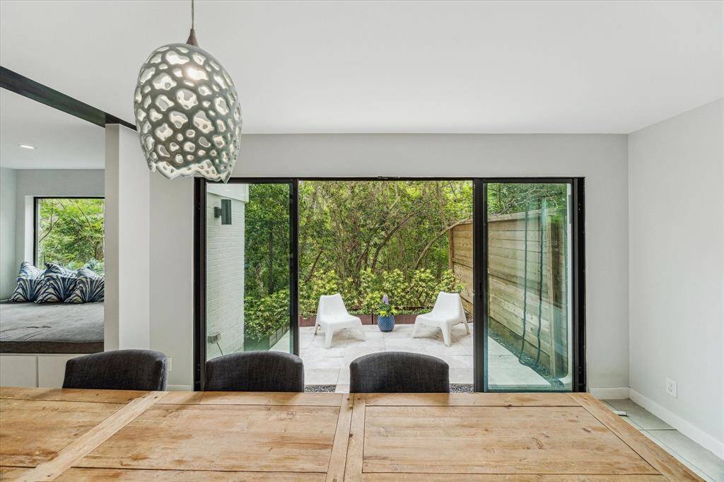 For a quiet cup of coffee or a relaxing reading spot, step out the other sliding doors to a private side patio.