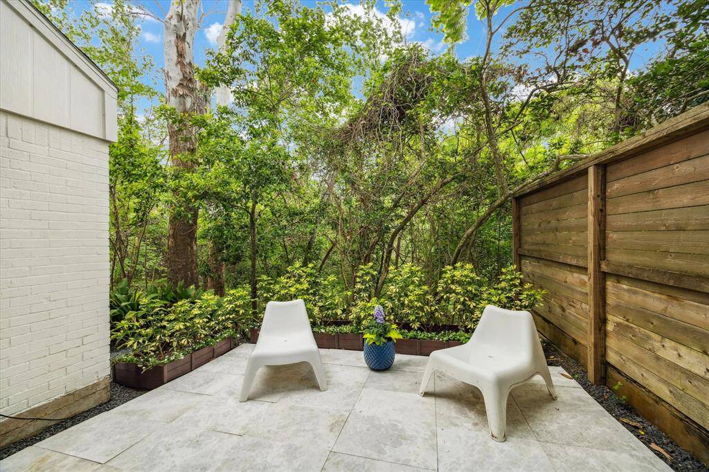 For a quiet cup of coffee or a relaxing reading spot, step out the other sliding doors to a private side patio.
