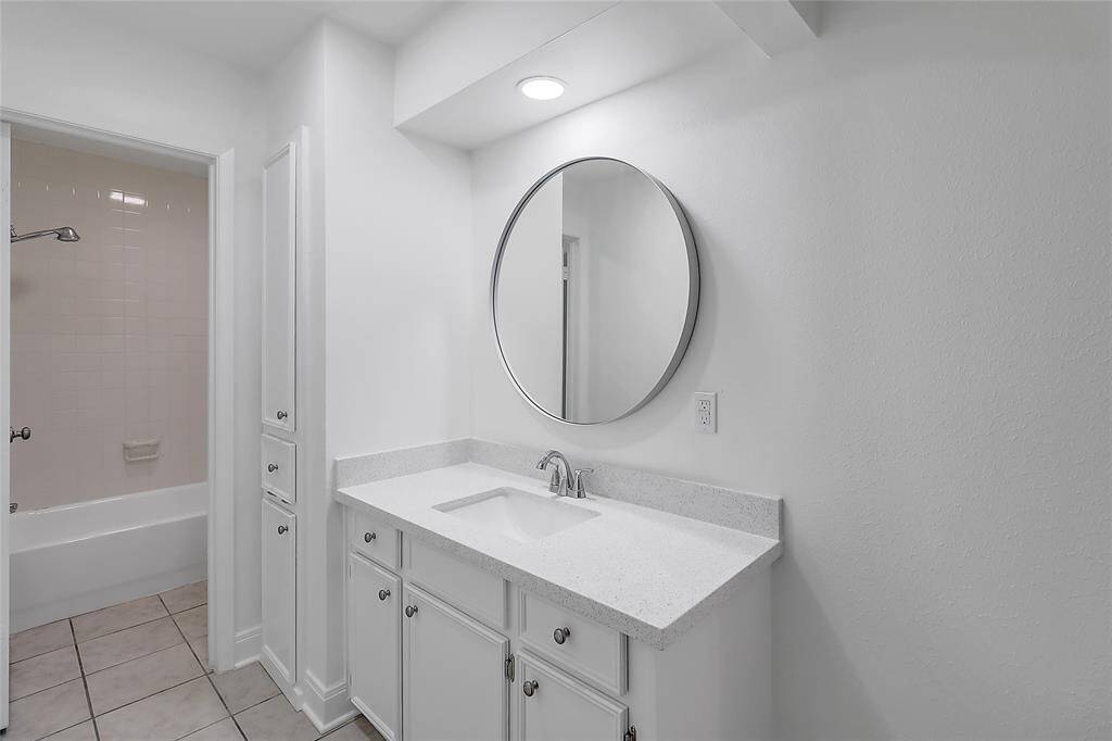 This remodeled white master bathroom provides a luxurious and refreshing escape, perfect for starting or ending your day.