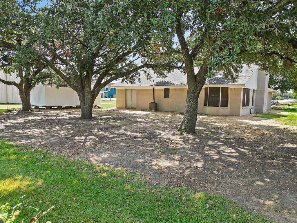 Outdoor space with beautiful mature trees providing plenty of shade for those hot Texas summers.