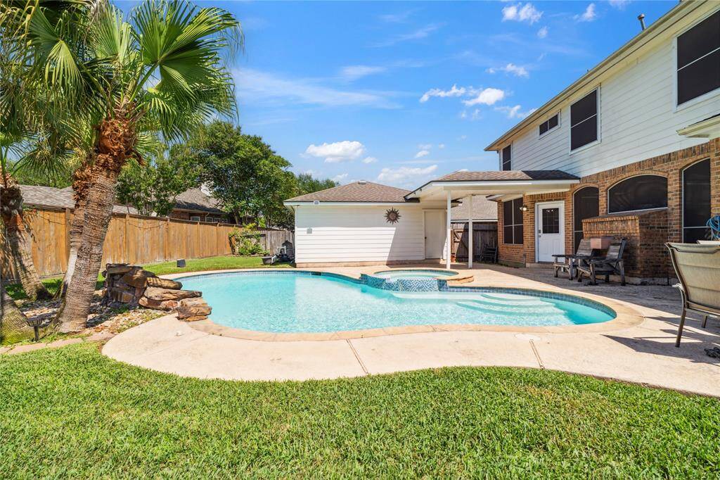 Welcome to your dream home in Eldridge Park! Step into resort-style living with this stunning backyard featuring a sparkling pool, spa, rock waterfall, and swaying palm trees — the perfect setting for relaxing weekends and summer gatherings.