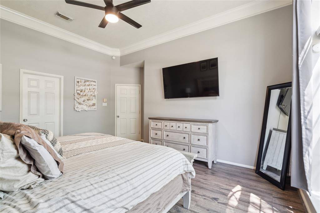 This alternate view of the primary suite highlights just how spacious and thoughtfully designed the room truly is.