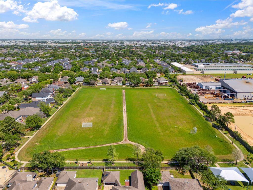 The neighborhood walking trail surrounds a wide-open green space, ideal for dog walks, early morning jogs, or a peaceful evening stroll. It's the lifestyle upgrade you didn’t know you needed.
