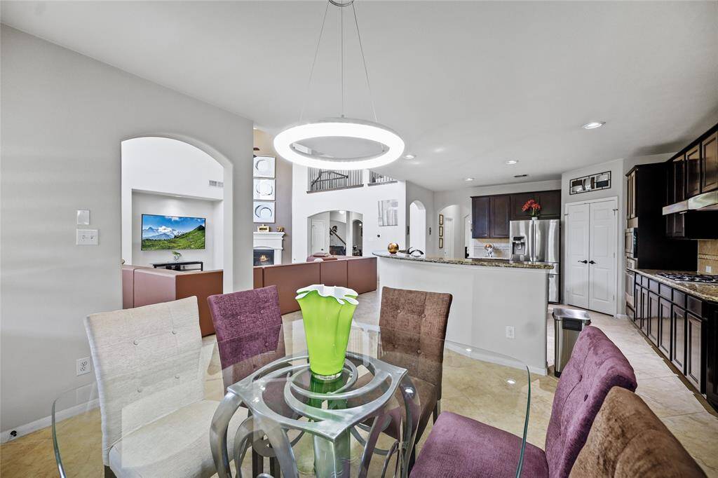 Cozy breakfast nook with a stylish light fixture.