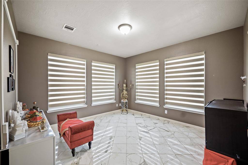 Versatile Flex Room perfect for a study, gym, or prayer space.