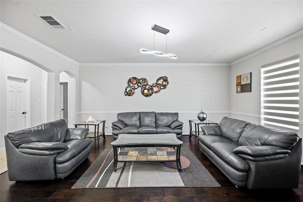 The spacious formal living room has abundant natural light.
