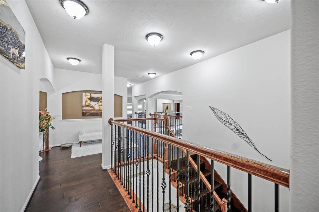 Elegant landing view from the front staircase, showcasing modern design and inviting ambiance.