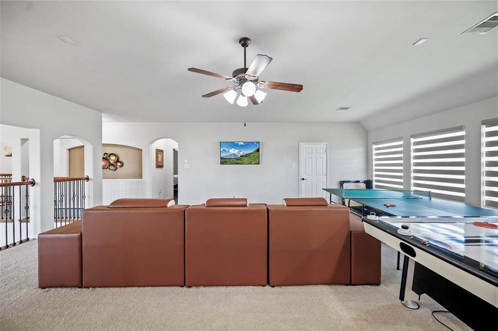 Spacious game room perfect for entertaining family and friends.