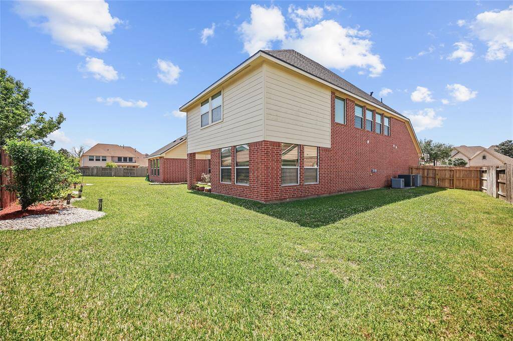 This large backyard ideal for outdoor activities and enjoying sunny days.
