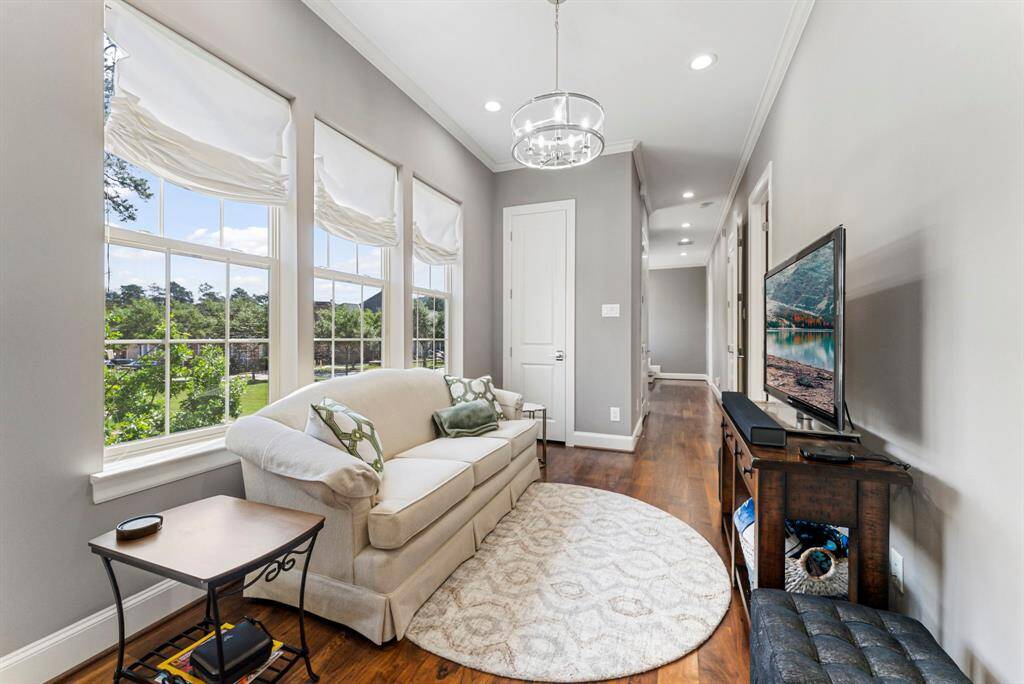Airy and light-filled second-floor flex space, perfect for a reading corner or TV area.