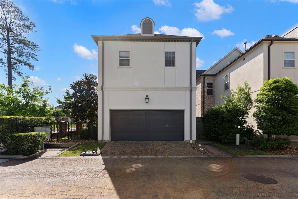Spacious two-car garage equipped with a Tesla charger.